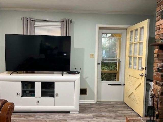 1017 Clifton Dr, Macon, GA 31204 - living area with wood finished floors, ornamental molding, and baseboards