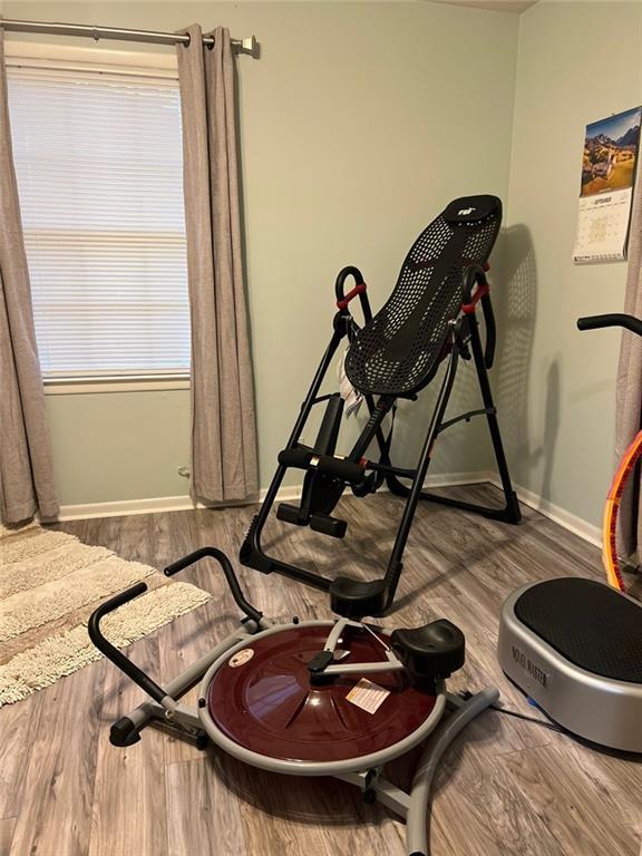1017 Clifton Dr, Macon, GA 31204 - exercise area with wood finished floors and baseboards