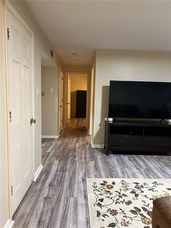 1017 Clifton Dr, Macon, GA 31204 - hall with wood finished floors and baseboards