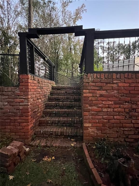 1017 Clifton Dr, Macon, GA 31204 - view of property exterior with stairway