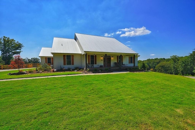 view of front of house with a front lawn and a porch