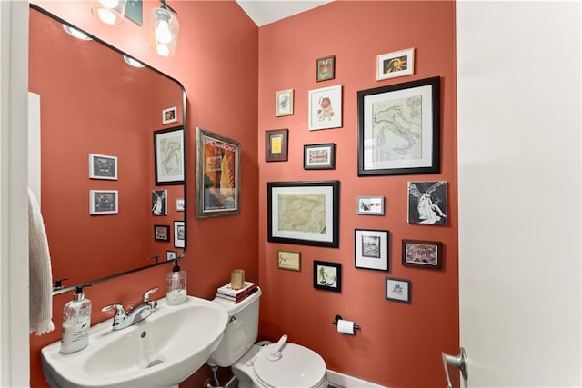 1382 Stirling Cir NW, Atlanta, GA 30318 - bathroom with toilet and a sink