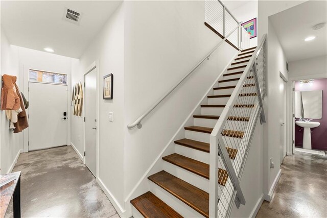 1382 Stirling Cir NW, Atlanta, GA 30318 - staircase with concrete floors, baseboards, recessed lighting, and visible vents