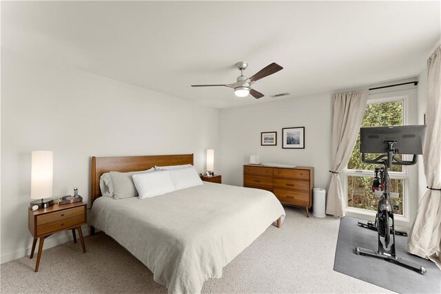 1382 Stirling Cir NW, Atlanta, GA 30318 - bedroom with light colored carpet, visible vents, ceiling fan, and baseboards