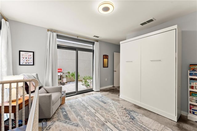 1382 Stirling Cir NW, Atlanta, GA 30318 - living area featuring baseboards, visible vents, and concrete flooring