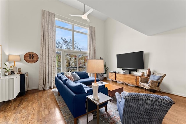 1382 Stirling Cir NW, Atlanta, GA 30318 - living area with wood finished floors, high vaulted ceiling, baseboards, and ceiling fan
