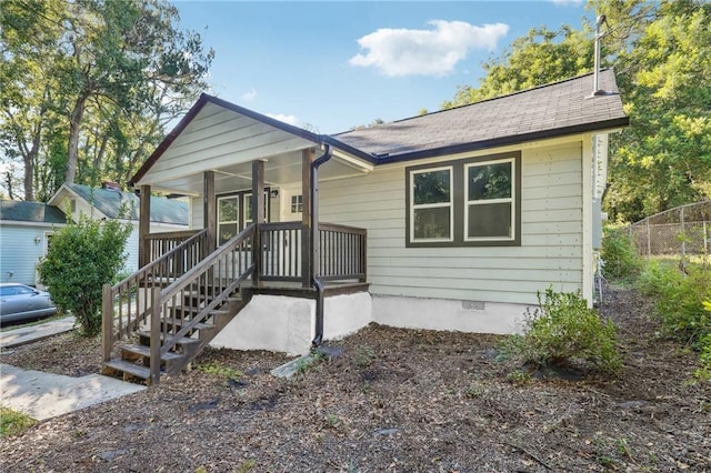 view of front of home featuring a sunroom