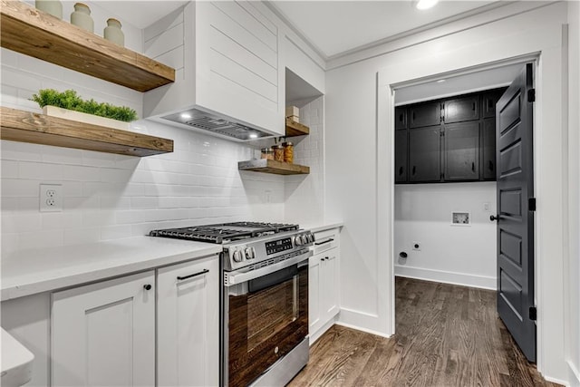 kitchen with custom range hood, dark wood-type flooring, tasteful backsplash, white cabinets, and stainless steel gas range