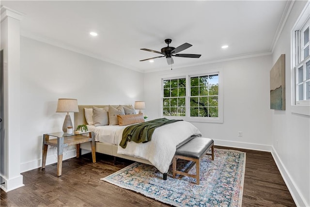 bedroom with ceiling fan, crown molding, and dark wood-type flooring