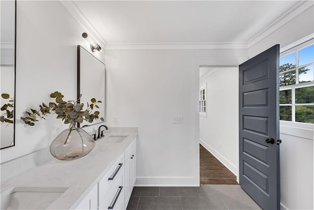 bathroom with vanity, ornamental molding, and tile patterned floors