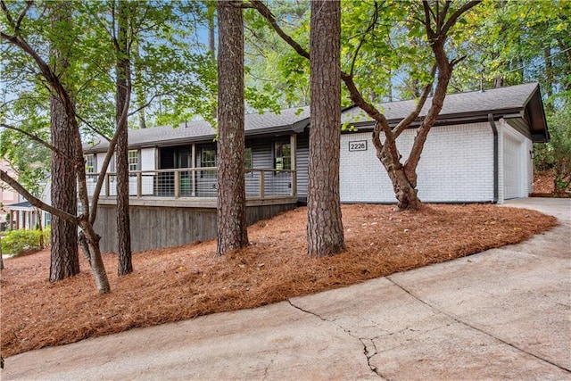 view of side of property with a garage