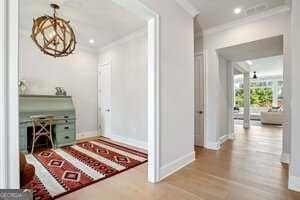 247 Widener Way, Peachtree City, GA 30269 - living area featuring wood finished floors and baseboards