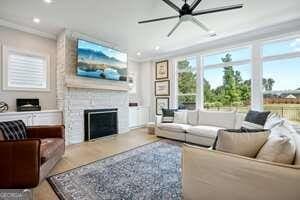 247 Widener Way, Peachtree City, GA 30269 - living room with wood finished floors, recessed lighting, and stairway