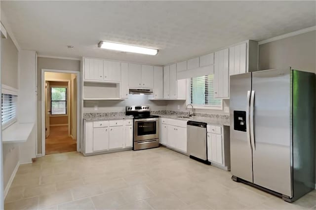 2041 Kramer Way, Marietta, GA 30062 - kitchen featuring appliances with stainless steel finishes, healthy amount of natural light, under cabinet range hood, open shelves, and ornamental molding