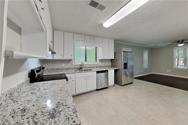2041 Kramer Way, Marietta, GA 30062 - kitchen featuring appliances with stainless steel finishes, a sink, white cabinetry, a textured ceiling, and open floor plan