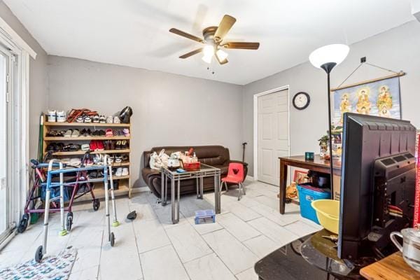 interior space featuring ceiling fan