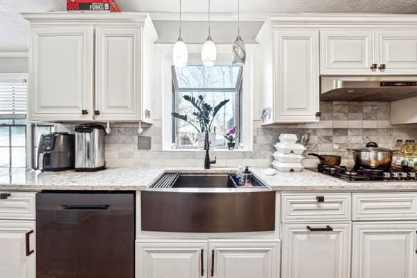 kitchen featuring white cabinetry, decorative light fixtures, stainless steel gas stovetop, and black dishwasher