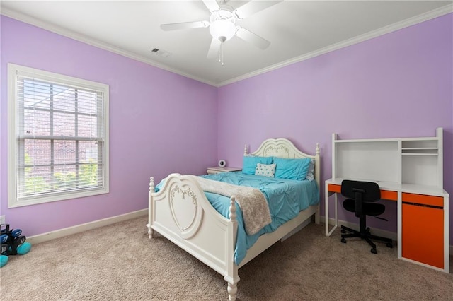 carpeted bedroom featuring visible vents, baseboards, crown molding, and ceiling fan