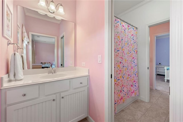 ensuite bathroom featuring connected bathroom, curtained shower, tile patterned flooring, and vanity