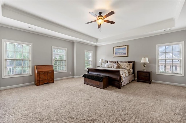 bedroom featuring crown molding, visible vents, carpet floors, and a raised ceiling