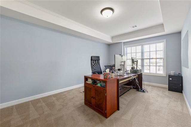 home office with baseboards, visible vents, light carpet, and a raised ceiling