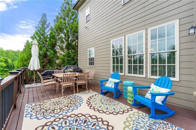 wooden deck featuring outdoor dining space