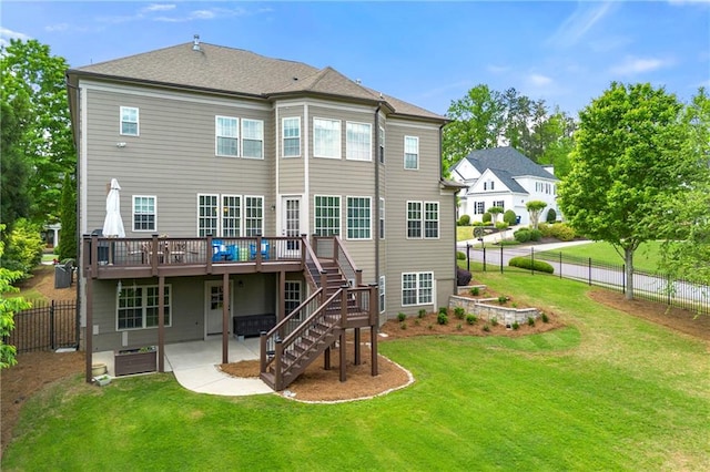 back of house with stairway, a patio, a wooden deck, and a fenced backyard
