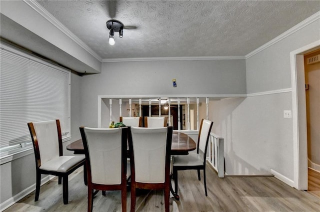 4444 Lisa Way NW, Lilburn, GA 30047 - dining room featuring wood finished floors, crown molding, and a textured ceiling