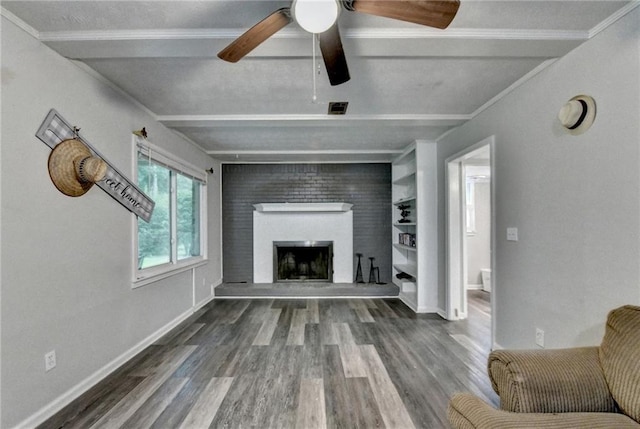 4444 Lisa Way NW, Lilburn, GA 30047 - living room with beamed ceiling, wood finished floors, ceiling fan, and a fireplace