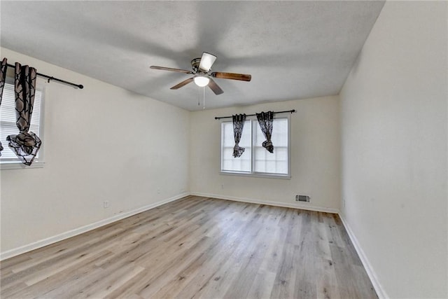 4444 Lisa Way NW, Lilburn, GA 30047 - unfurnished room featuring wood finished floors and a ceiling fan