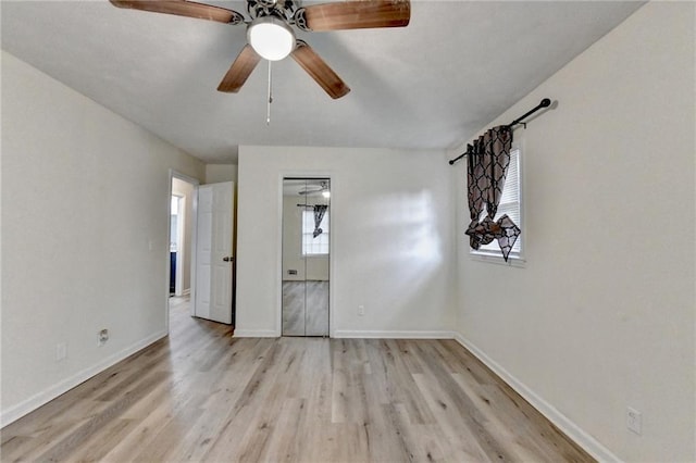 4444 Lisa Way NW, Lilburn, GA 30047 - unfurnished bedroom featuring light wood-style flooring and a ceiling fan