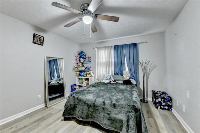 4444 Lisa Way NW, Lilburn, GA 30047 - bedroom with light wood-type flooring and a ceiling fan