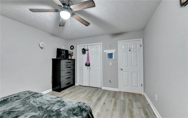 4444 Lisa Way NW, Lilburn, GA 30047 - bedroom with light wood-style flooring, a closet, and a ceiling fan