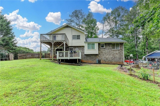 4444 Lisa Way NW, Lilburn, GA 30047 - back of house featuring a wooden deck and brick siding