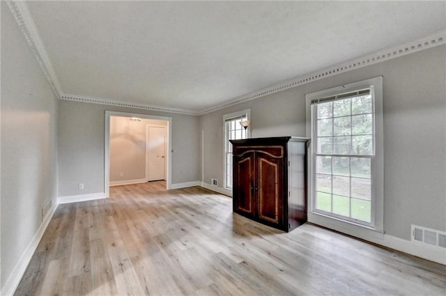 4444 Lisa Way NW, Lilburn, GA 30047 - unfurnished living room featuring light wood finished floors and crown molding