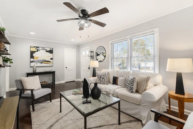 living room featuring ornamental molding, ceiling fan, and wood-type flooring