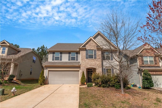 view of front of property featuring a garage and driveway