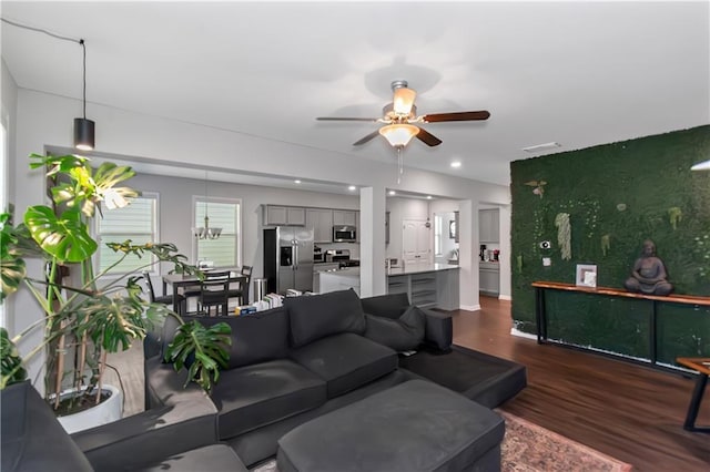 living room featuring recessed lighting, a ceiling fan, and dark wood-style flooring