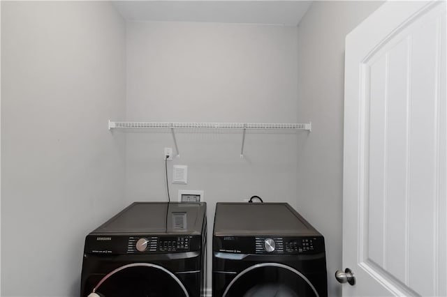 laundry area featuring laundry area and washer and clothes dryer