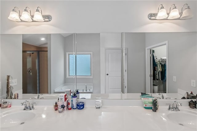 full bath featuring vanity, a bath, a shower stall, and vaulted ceiling