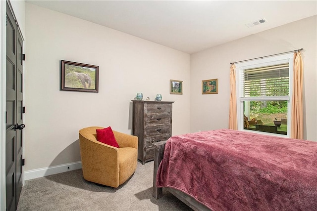 carpeted bedroom with baseboards