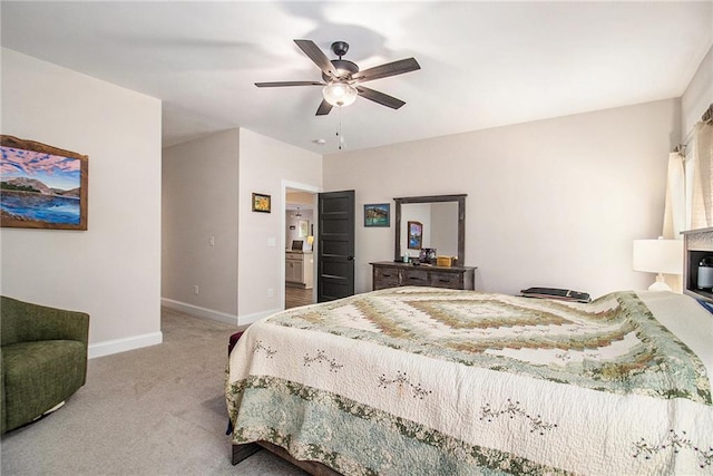 carpeted bedroom with baseboards and ceiling fan