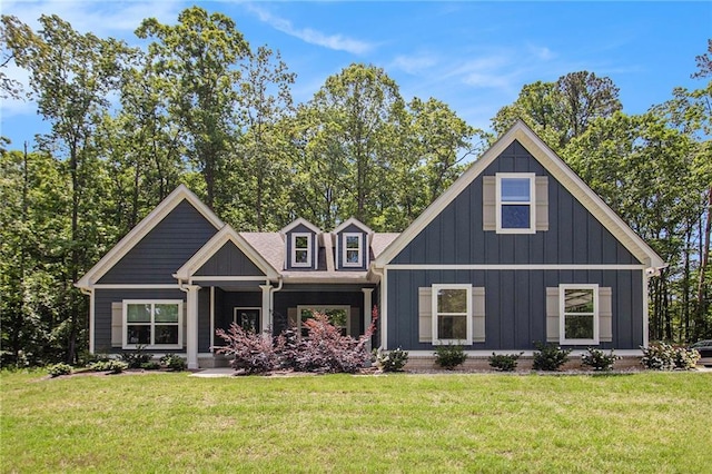 view of front facade featuring a front lawn and board and batten siding