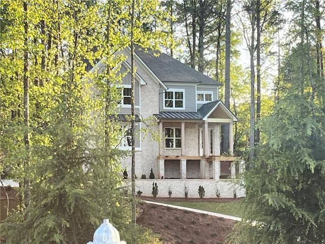1005 Liberty Springs Dr, Woodstock, GA 30188 - view of front of property featuring a standing seam roof and a metal roof