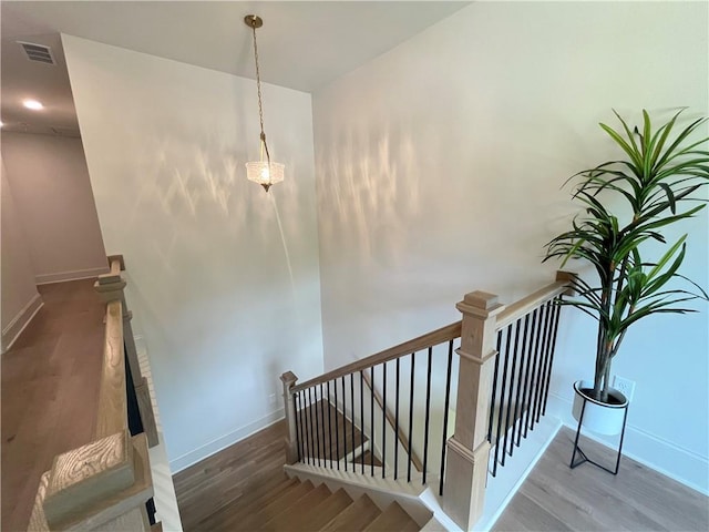 1005 Liberty Springs Dr, Woodstock, GA 30188 - stairway featuring wood finished floors and baseboards