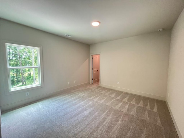 1005 Liberty Springs Dr, Woodstock, GA 30188 - spare room with light colored carpet and baseboards