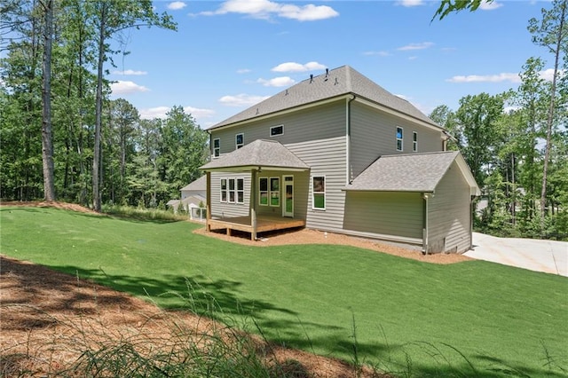 1005 Liberty Springs Dr, Woodstock, GA 30188 - rear view of house featuring a deck, a yard, and a shingled roof