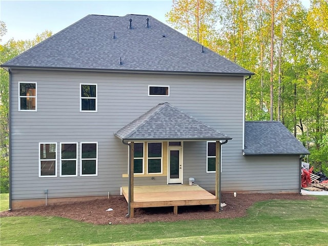 1005 Liberty Springs Dr, Woodstock, GA 30188 - back of house featuring a wooden deck, a lawn, and a shingled roof
