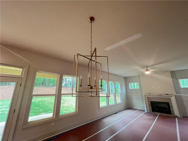 1005 Liberty Springs Dr, Woodstock, GA 30188 - unfurnished living room with healthy amount of natural light, a ceiling fan, a fireplace, and a chandelier