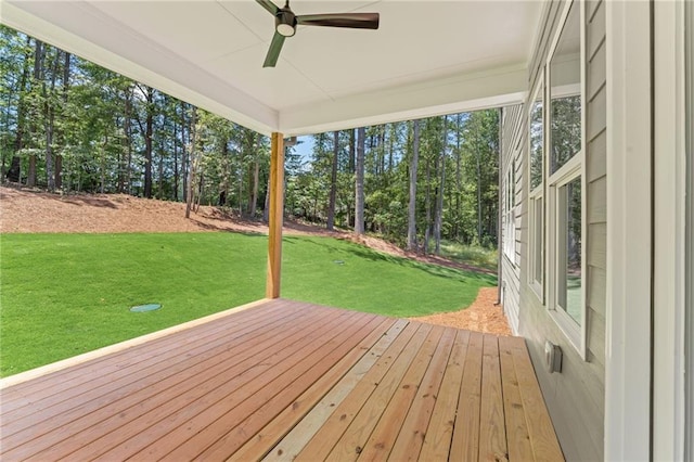 1005 Liberty Springs Dr, Woodstock, GA 30188 - wooden deck featuring ceiling fan, a yard, and view of wooded area